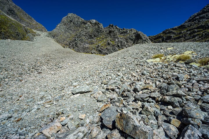 Heading up the scree to rejoin marked route